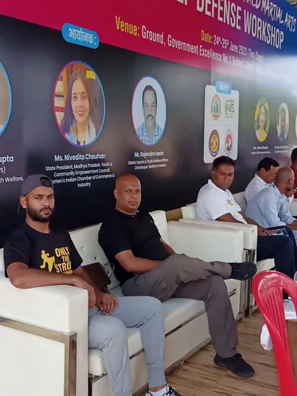 Our team on the dais at the self-defense workshop, ready to share their expertise with the community.