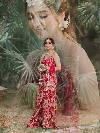 A creative double-exposure portrait of the bride from her Haldi ceremony. The artistic layering of images creates a dreamy and beautiful tribute to her pre-wedding glow.
