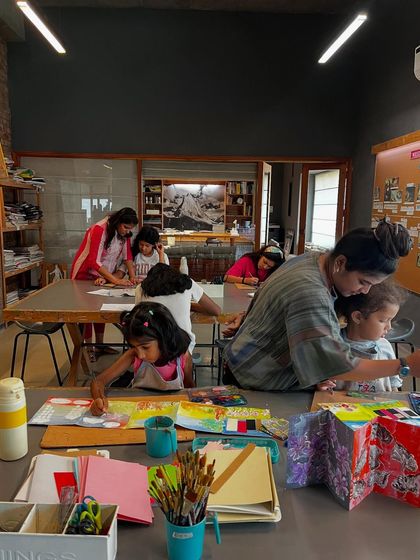 A glimpse into the creative buzz of our summer camp. The studio is filled with young artists, each absorbed in their own project, with instructors on hand to assist and encourage them.