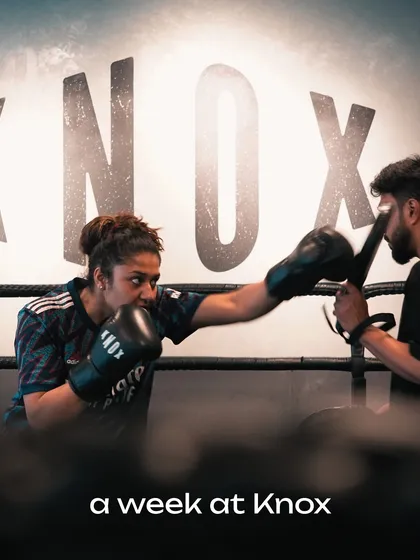 Step into the ring and find your fire. This shot captures the intensity and focus of a one on one boxing session, where our coach works with a client on pad drills to sharpen technique, power, and speed.