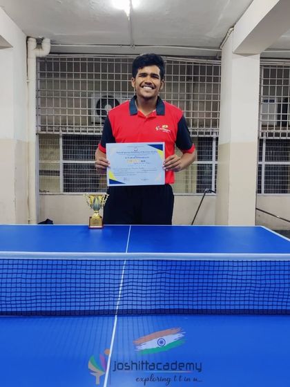 Celebrating Praneet, our inter-college table tennis champion. He stands proudly with his certificate and trophy, representing the success our players achieve at every level.