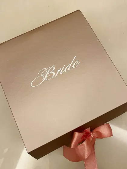 Another view of the elegant 'Bride' gift box, tied with a soft pink ribbon.
