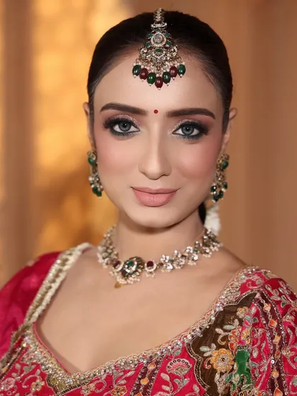 Look at her beautiful eyes. I created a soft smokey eye with a sharp wing to make them pop, giving her that perfect, mesmerizing bridal gaze.