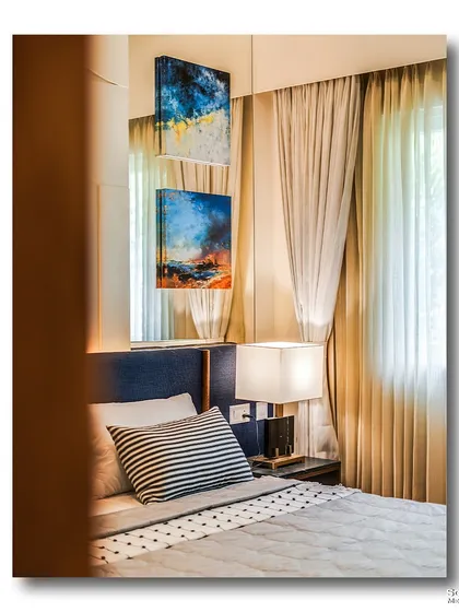 A glimpse into a modern bedroom, where abstract art is reflected in a mirrored wall. This creative composition plays with light and reflection, adding depth and an artistic touch to the room.
