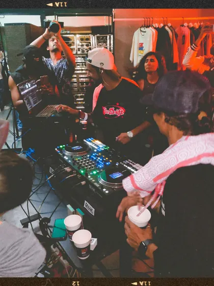 A view from behind the decks, showing the crowd and my collaborator DJ Johney. The energy at the first Slw Drift party was amazing.