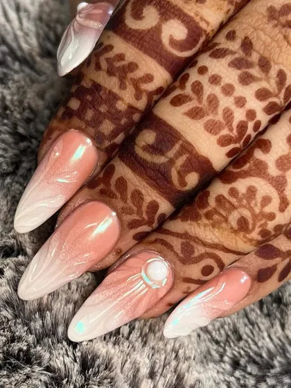 A close-up of the airbrush ombre and 3D nail art. The smooth gradient and precise line work are key to achieving this high-end look.
