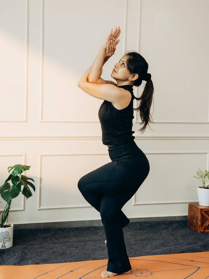 Garudasana (Eagle Pose) is a beautiful and challenging balance that improves focus and opens the shoulder and hip joints.
