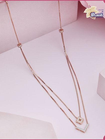Elevate your everyday style with this stunning two-layer chain. The design features a V-shaped pendant and a square diamond charm, creating an effortlessly chic and modern layered look.