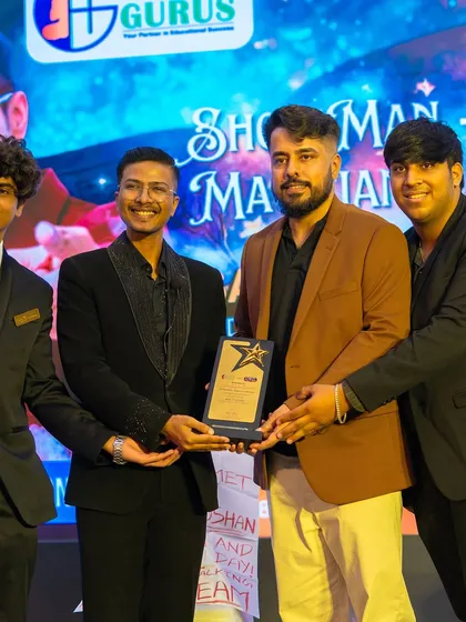 Proudly accepting my award on stage. This recognition fuels my passion to continue pushing the boundaries of magic and performance.