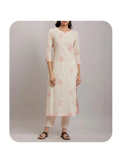 This simple off-white kurti with delicate pink block prints is an example of my daily wear tailoring. The straight cut and three-quarter sleeves make it a comfortable and versatile piece that can be paired with straight pants or palazzos.