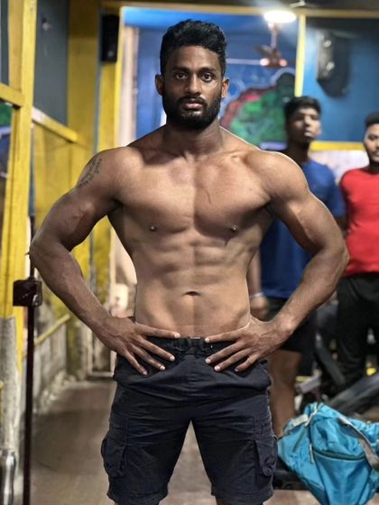 A front relaxed pose showing a solid core and upper body development. This is the look of functional strength.