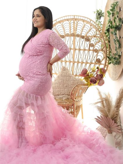 Blooming in pink. This full-length shot shows the incredible volume and detail of the pink ruffled gown, creating a fairy-tale-like image.