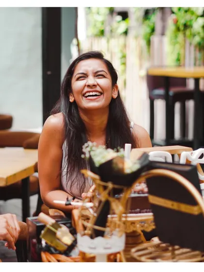 We sell happiness. A candid shot of a woman laughing with pure joy during her surprise celebration.