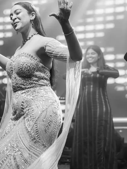 A graceful black and white photo of a ladies' group performance.