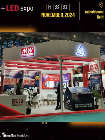The Mean Well booth features a bold red and white design, highlighting their high-performance LED drivers and SMPS.