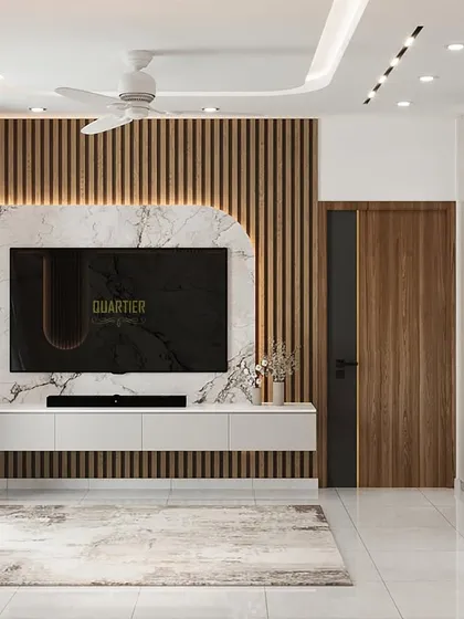 A 3D visualization of a master bedroom TV wall. The design combines fluted wooden louvers with a UV marble sheet, creating a stunning contrast of textures. The room also features a large wardrobe with a matching reverse arch design.