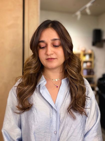 That perfect shade of bronde. We used a bleach and tone technique to lift the hair to this beautiful blend of blonde and brown, creating a soft and sophisticated look.