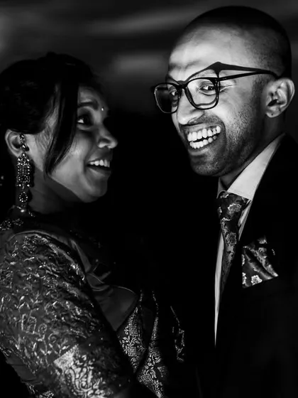 The "vampire" pose. Before the laughter, Ashwin got into character, and we created this fun, dramatic black and white portrait. I love it when couples are up for trying something different.