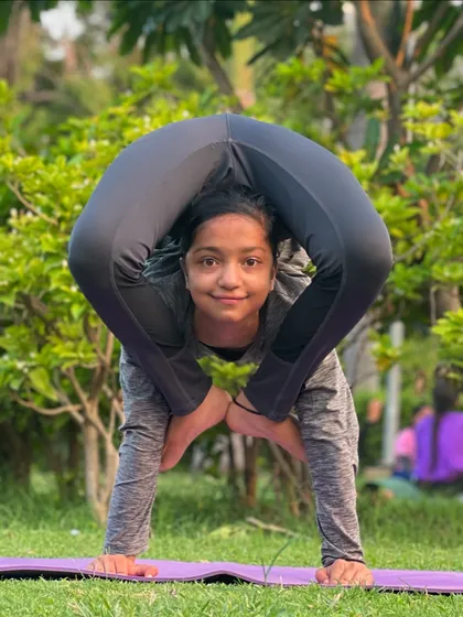 Another look at this incredible backbend pose. The student's calm face and steady gaze show the focus that comes with deep practice.