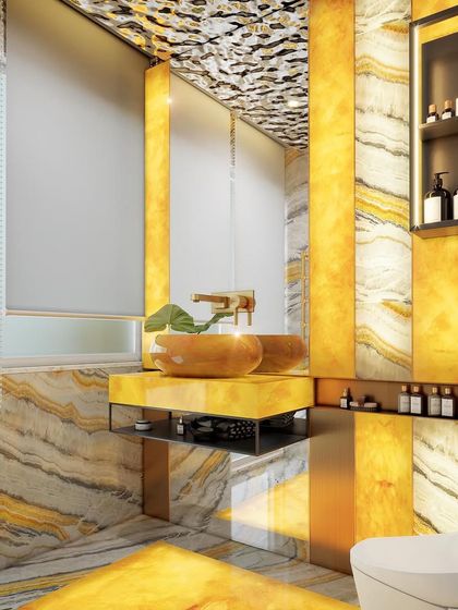 A bathroom with a glowing honey onyx feature wall and vanity. The warm light creates a luxurious and inviting ambiance, complemented by the unique textured ceiling.