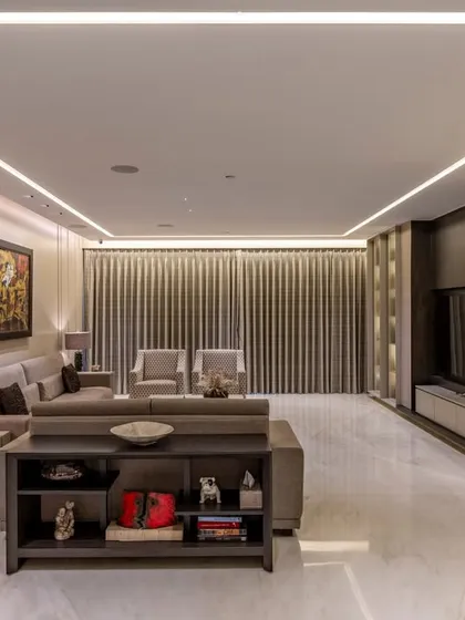 A view of the media zone in this BKC residence, where clean lines and integrated lighting create a sophisticated entertainment hub. The custom shelving and console maintain a sleek, uncluttered look.