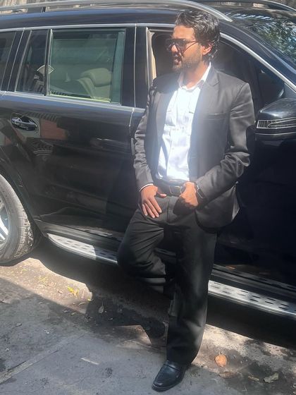 Taking a moment by my car. The rewards of hard work and successful outcomes are a great motivator.