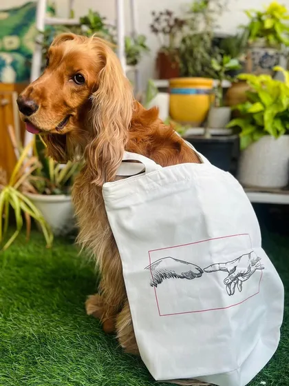We found the perfect tote bag for a dog mom from Slash7. The "Creation of Adam" parody with a paw and hand is just perfect.