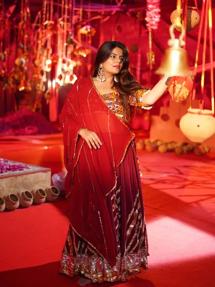A quiet moment of devotion during a Garba performance. It's not just about the dance, but also about the spiritual connection.