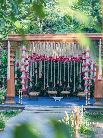 The summer wedding mandap, a perfect blend of traditional architecture and fresh, modern floral design.
