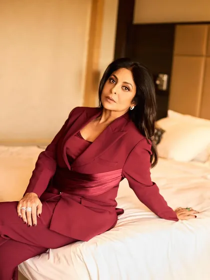 Another angle of the maroon suit, highlighting its clean lines and the beautiful tailoring.