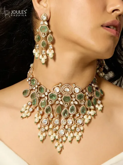 The complete Emrosia bridal set, as seen in Cultured Wedding Magazine, featuring a grand necklace and matching earrings with emeralds and polki.
