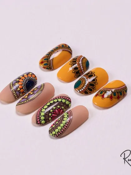 Bringing a touch of desi-inspired art to nails. This collection showcases my hand-painted mandala designs, where every dot and line is carefully placed to create these intricate, traditional patterns.