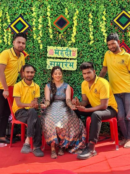 My team is ready to serve at a festive mehndi ceremony.
