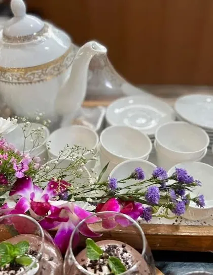 My dessert and kahwa platter is perfect for special occasions. It includes a variety of sweets and a pot of fragrant kahwa, served in elegant crockery.