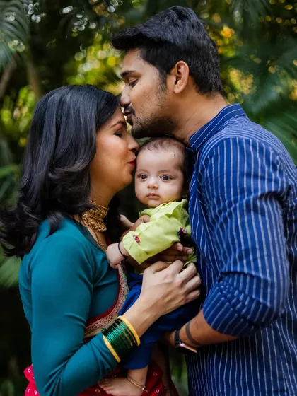 A newborn's first few weeks are so fleeting. Capturing the love of new parents during their baby's naming ceremony is an honor. This portrait shows the complete circle of family love.