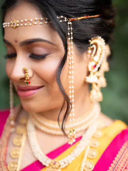 A detailed shot of the eye makeup and traditional jewellery. I used soft brown and gold tones to create a look that is warm and enhances her features without being heavy.