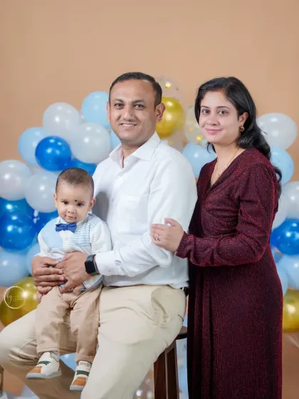 A formal family portrait from a first birthday session. Even during a fun celebration, we take time to capture a more classic portrait that you can hang on your wall for years to come.