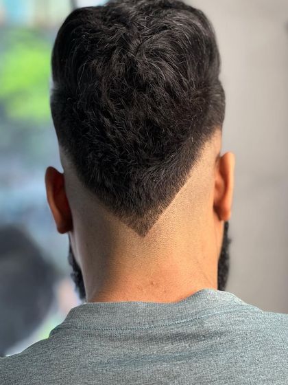 A V-shaped neckline is a great way to add a custom detail to your fade haircut.