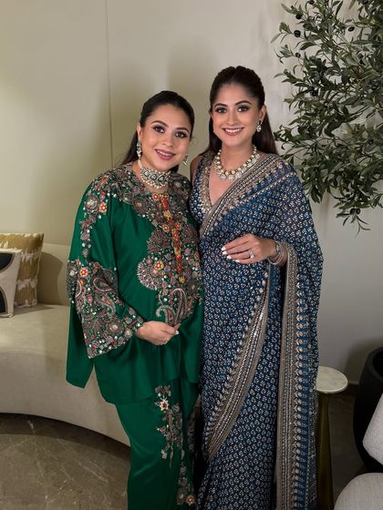 Another lovely shot of the sisters, capturing the special bond and the celebratory atmosphere of the day.