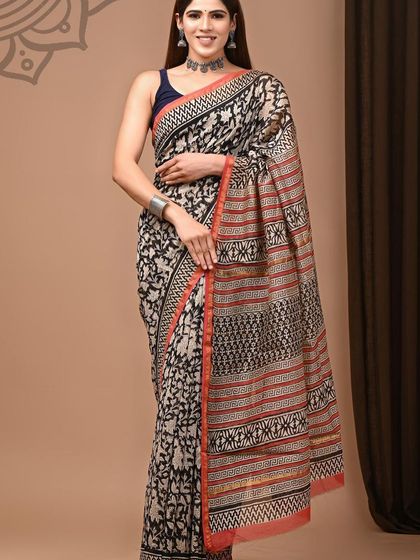 A beautiful pure Chanderi cotton silk saree with an intricate all-over hand block print and a contrasting red border.
