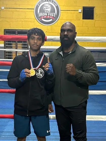This is the result of hard work and dedication. Here I am with Scott, one of our "Golden Boys," after he won his championship. Seeing our students achieve their goals is the greatest reward.