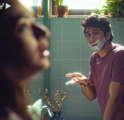 A playful bathroom scene from the commercial. The casual t-shirt and everyday setting were key to creating the film's authentic and relatable feel.