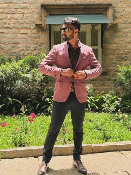 A full-length shot showing my formal attire. It's important to match the event's dress code while maintaining my personal style.