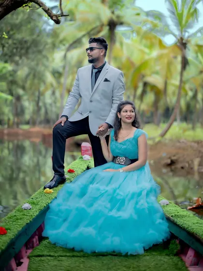A beautiful and stylish pre-wedding portrait on a boat. The blue gown looks stunning against the backdrop of the water and palm trees.