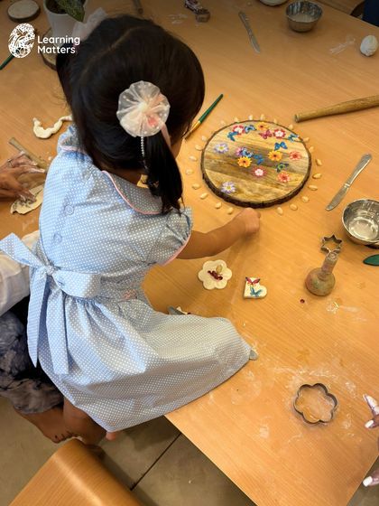 A beautiful display of a child's work with natural materials and clay. We honor the process by creating spaces where children's creations are valued and displayed, reinforcing their sense of capability.