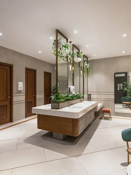 The washroom block for the F-40A Farmhouse, where luxury is conveyed through subtle details. The material palette of greys, wood, and brass, combined with integrated greenery, creates a serene space that blends into the landscape.