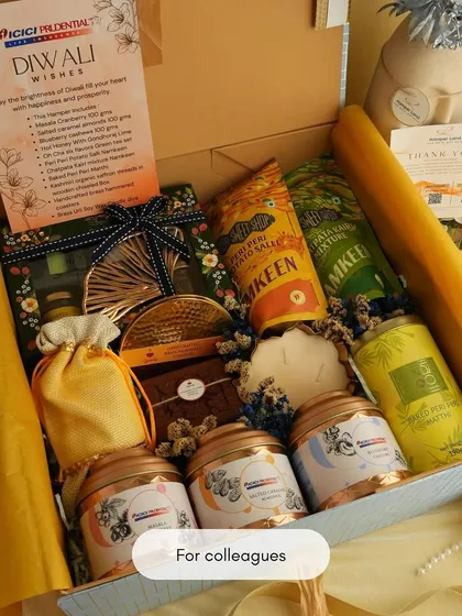 A great example of a corporate Diwali gift created for ICICI Prudential. This hamper includes a branded card and a curated selection of festive treats, perfect for showing employee and client appreciation.