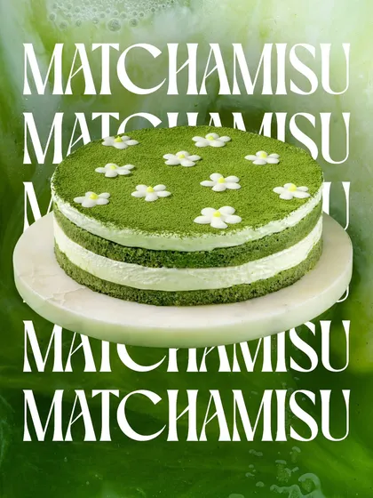 Our Matchamisu, a Japanese-inspired twist on the classic Tiramisu. It's decorated with delicate sugar flowers, making it as beautiful as it is delicious.
