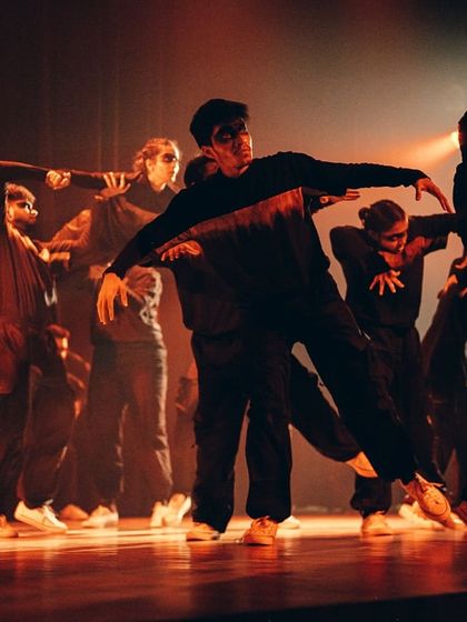 A dynamic shot capturing the intricate and emotional movement of the "Hope" choreography.