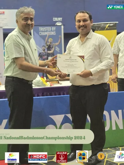 An umpire being presented with a certificate of appreciation. I ensure that all technical officials are treated with respect, which helps in attracting the best officials for my tournaments.